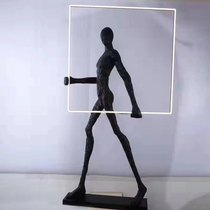 картинка Торшер Man carries light square