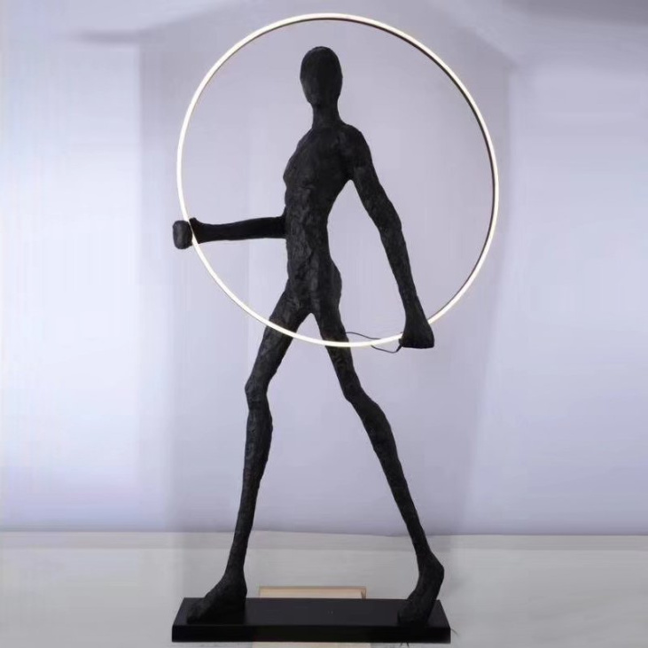 картинка Торшер Man carries light circle